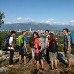 Travelers exploring scenic landmarks across the USA representing the best budget travel destinations for affordable vacations